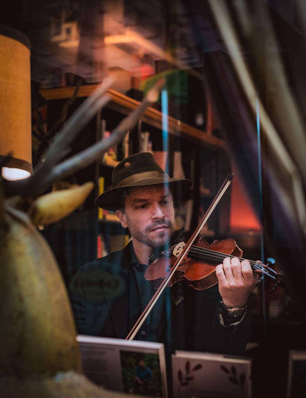 Joseph Arnold playing violin, candlelit window light